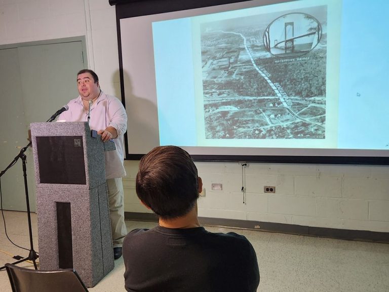 Jason Antos presents history of Queens' named places at the North Forest Park Library, December 2022.